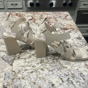 This off whiten sander pair had a block heel and has never been worn price tags